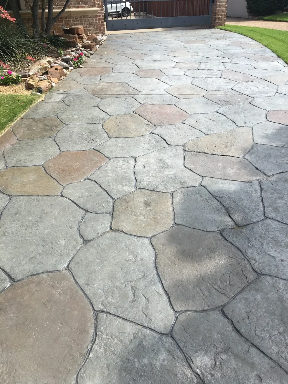 A stamped pool deck transformation by Lucky’s Concrete in Naples